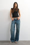 Front image of a model wearing the Adela sl rib boyfriend tank top in black, by brand Top shop