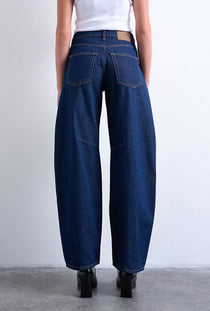 Back image of a model wearing the Barrel hr denim jeans in dark denim, by brand Top shop