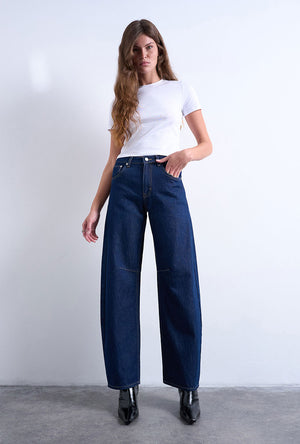 Front image of a model wearing the Barrel hr denim jeans in dark denim, by brand Top shop