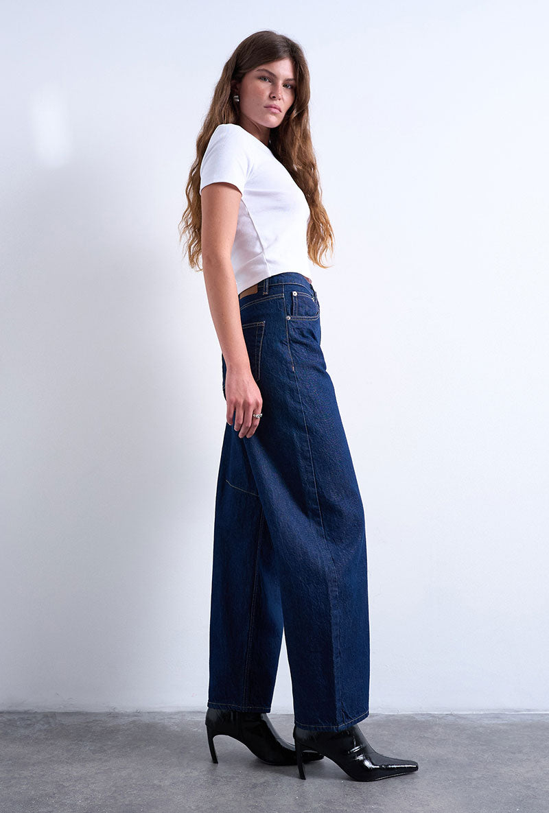 Front image of a model wearing Barrel hr denim jeans in dark denim, by brand Top shop