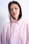 Front image of a model wearing the Bibi ls ultimate hoodie in pink, by brand Top shop