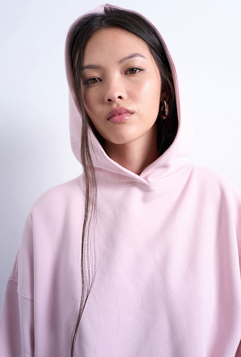 Front image of a model wearing Bibi ls ultimate hoodie in pink, by brand Top shop