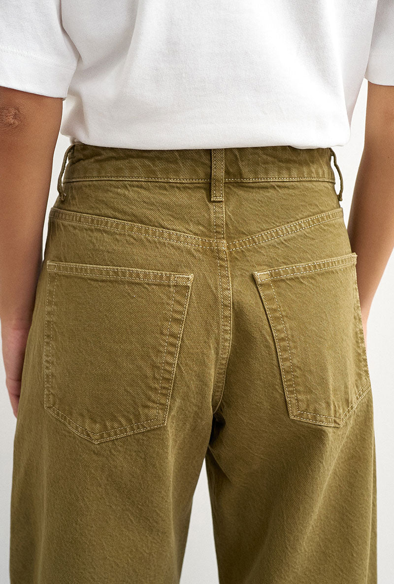Back image of a model wearing Barrel khaki jeans in khaki, by brand Top shop