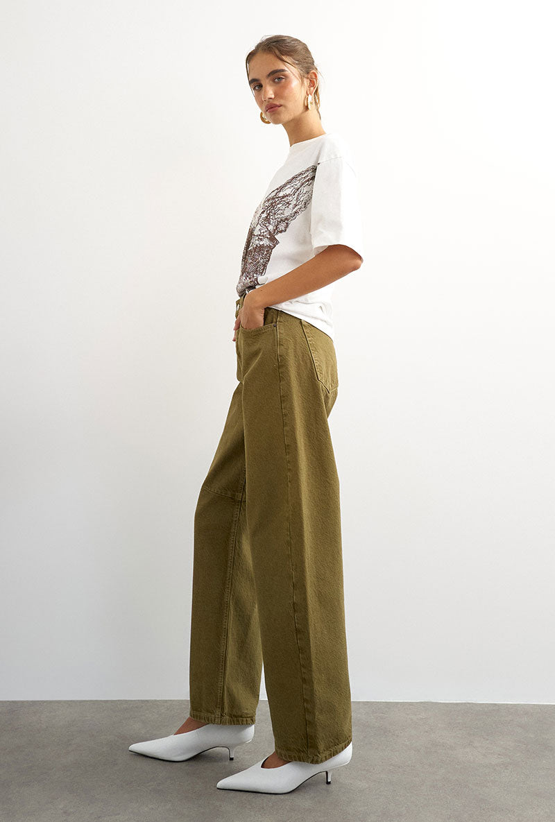 Front image of a model wearing Barrel khaki jeans in khaki, by brand Top shop
