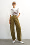 Front image of a model wearing Barrel khaki jeans in khaki, by brand Top shop