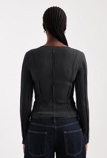 Back image of a model wearing the Belma l/s oneck sheer top in black, by brand Top shop