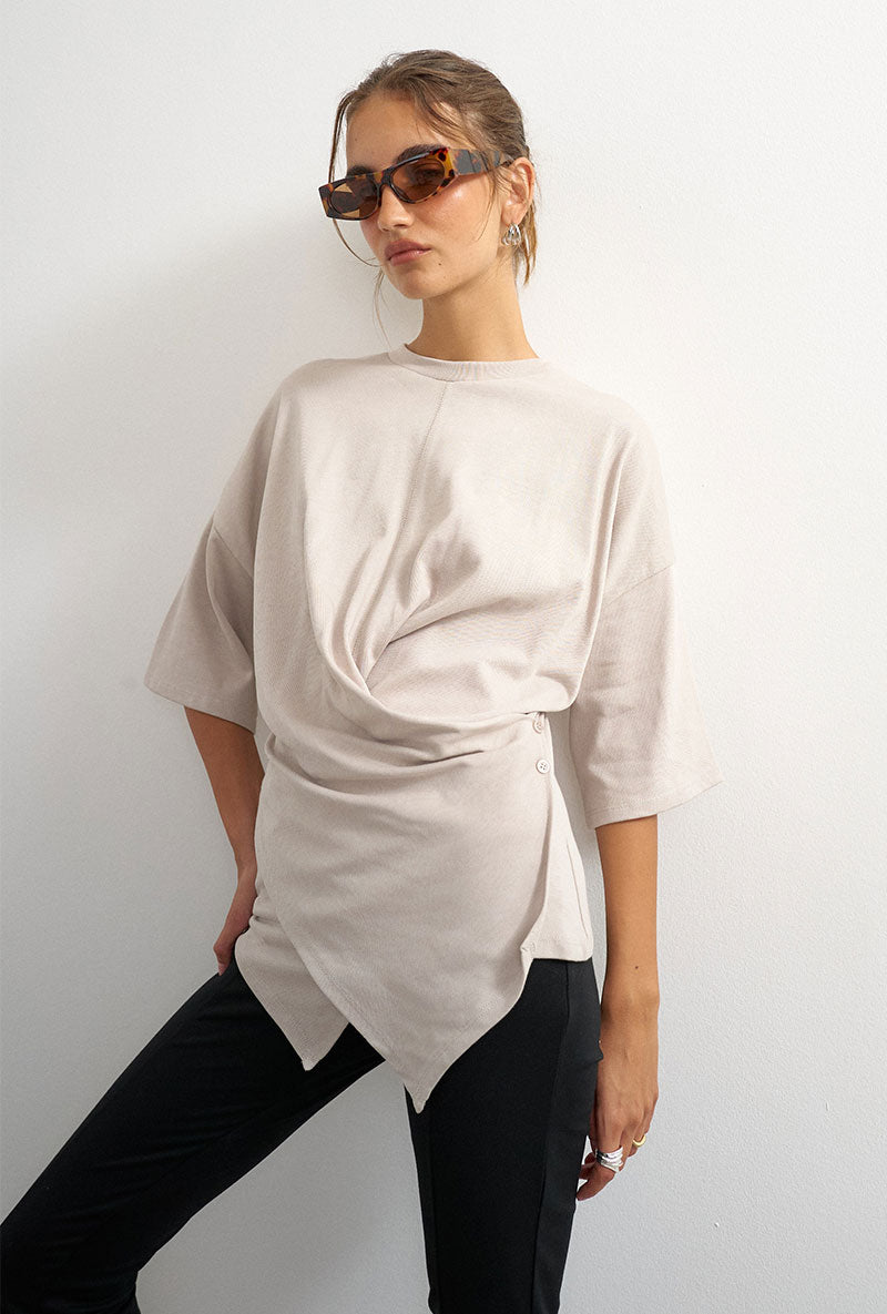 Front image of a model wearing Betja ss wrap tshirt in beige, by brand Top shop