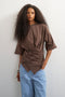 Front image of a model wearing Betja ss wrap tshirt in chocolate, by brand Top shop