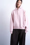 Front image of a model wearing the Bibi ls ultimate hoodie in pink, by brand Top shop