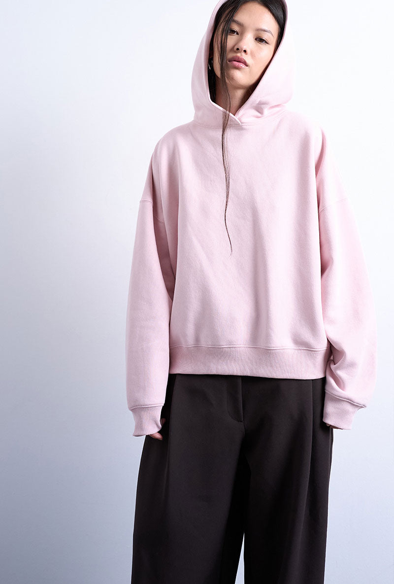 Front image of a model wearing Bibi ls ultimate hoodie in pink, by brand Top shop