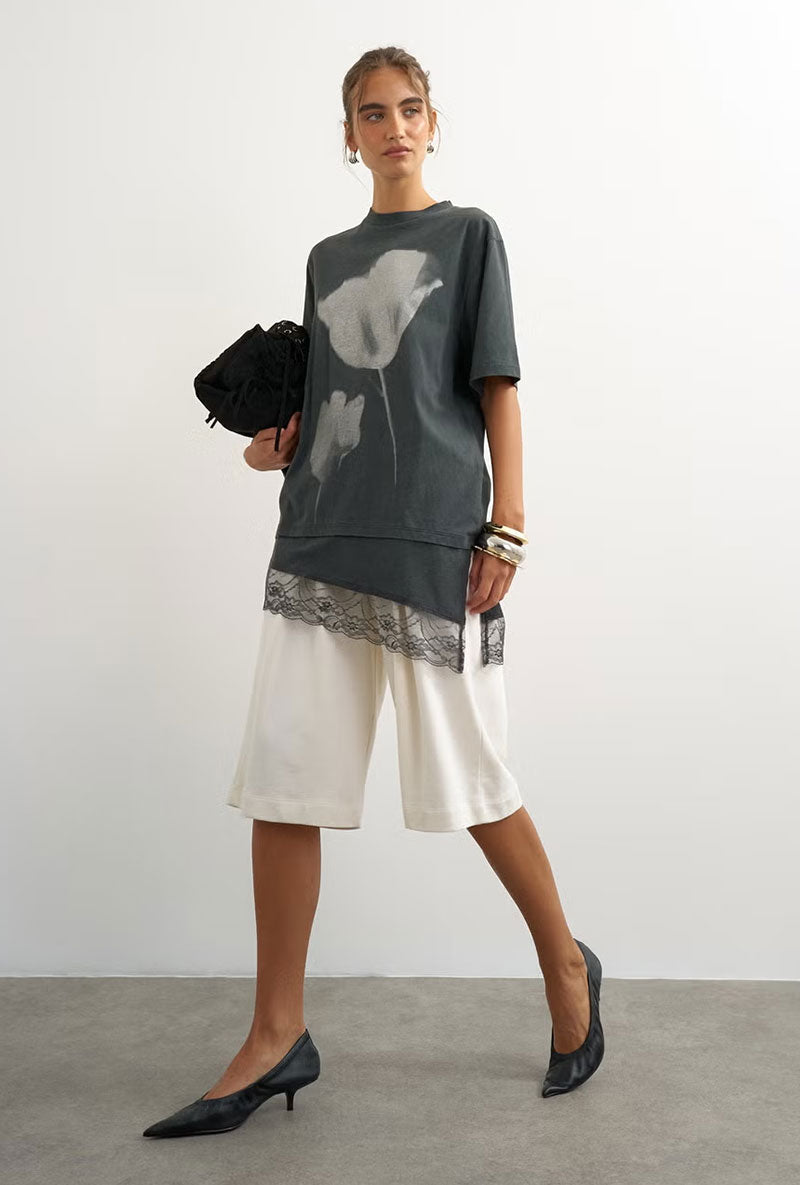 Front image of a model wearing Brit ss lace floral tee in black, by brand Top shop