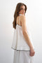 Back image of a model wearing the Caro cami top in off white, by brand Top shop