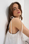 Front image of a model wearing the Caro cami top in off white, by brand Top shop