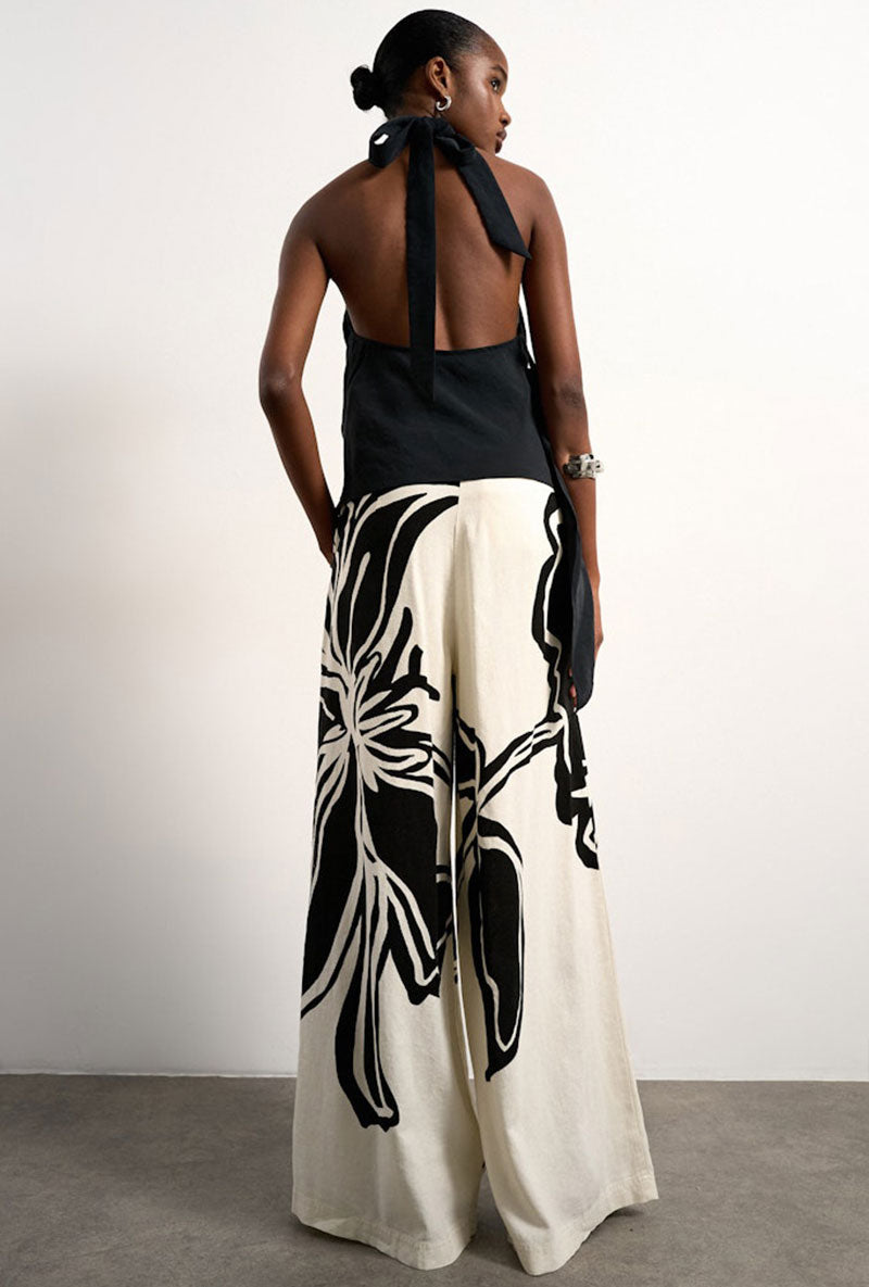 Back image of a model wearing Fiona wide leg trousers in off white, by brand Top shop
