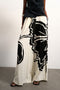 Front image of a model wearing Fiona wide leg trousers in off white, by brand Top shop