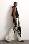 Front image of a model wearing the Fiona wide leg trousers in off white, by brand Top shop