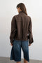 Back image of a model wearing the Freya denim jacket in brown, by brand Top shop