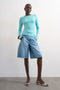 Front image of a model wearing Joa denim barrel jort in denim, by brand Top shop