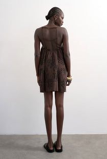 Back image of a model wearing the Mia trapeze mini dress in chocolate, by brand Top shop