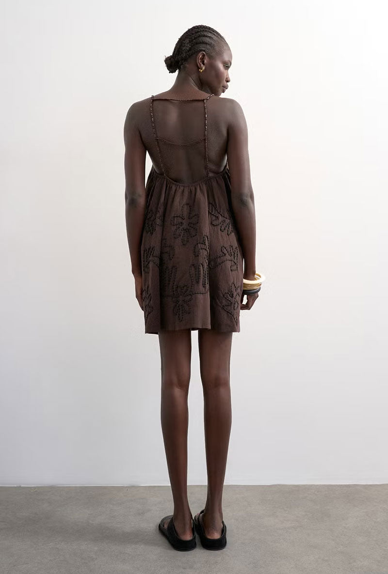 Back image of a model wearing Mia trapeze mini dress in chocolate, by brand Top shop