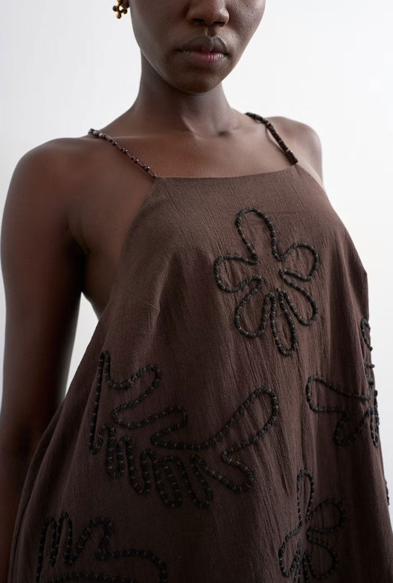 Front image of a model wearing Mia trapeze mini dress in chocolate, by brand Top shop