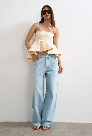 Front image of a model wearing the Mina sl top in cream, by brand Top shop