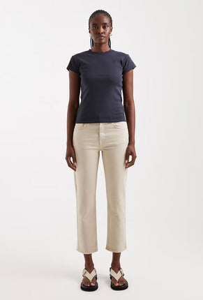 Front image of a model wearing Orson mid rise jeans in beige, by brand Top shop