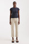 Front image of a model wearing Orson mid rise jeans in beige, by brand Top shop