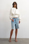 Front image of a model wearing Rega cinch waist sweatshirt in off white, by brand Top shop