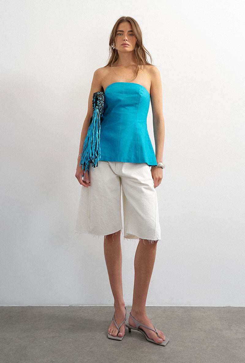 Front image of a model wearing Rosa tailored bandeau in blue, by brand Top shop