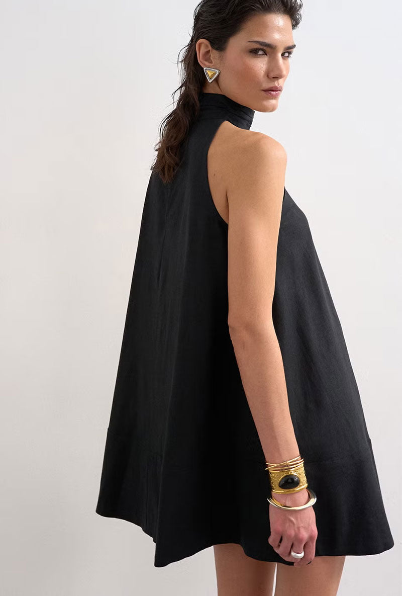 Back image of a model wearing Sara sl trapeze mini dress in black, by brand Top shop