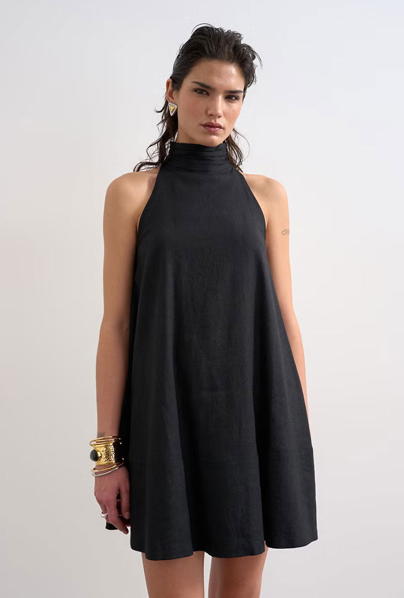 Front image of a model wearing Sara sl trapeze mini dress in black, by brand Top shop