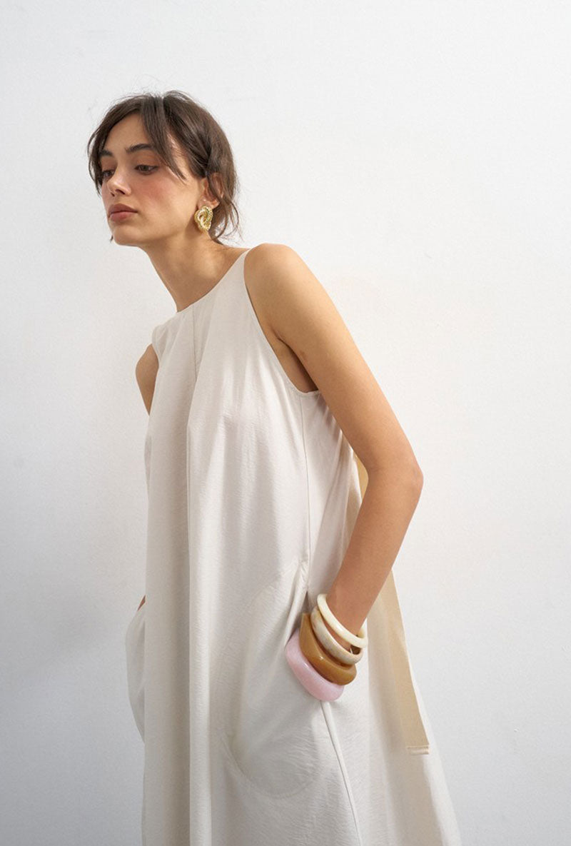 Front image of a model wearing Selena open back maxi dress in beige, by brand Top shop
