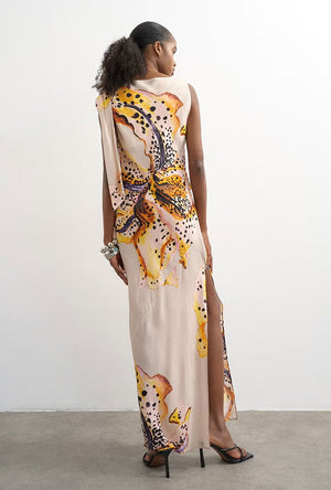 Back image of a model wearing the Vana tie neck maxi dress in beige, by brand Top shop