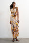 Front image of a model wearing Vana tie neck maxi dress in beige, by brand Top shop