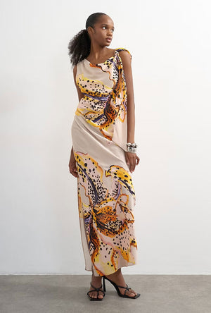 Front image of a model wearing the Vana tie neck maxi dress in beige, by brand Top shop