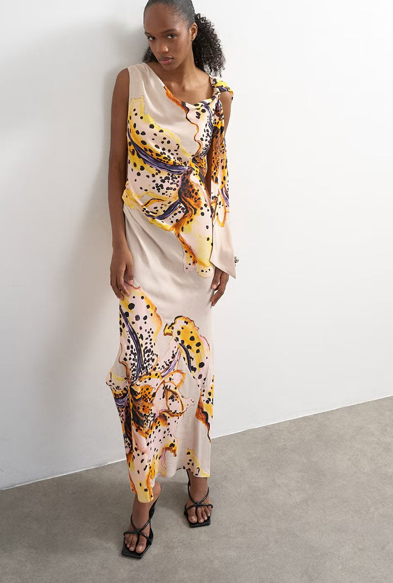 Front image of a model wearing Vana tie neck maxi dress in beige, by brand Top shop