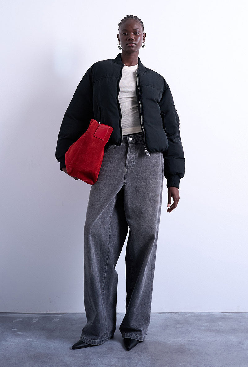 Front image of a model wearing Vera bomber in black, by brand Top shop