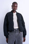 Front image of a model wearing Vera bomber in black, by brand Top shop