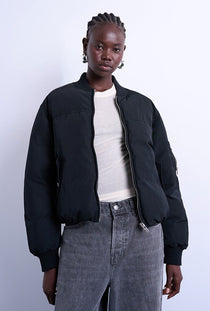 Front image of a model wearing the Vera bomber in black, by brand Top shop