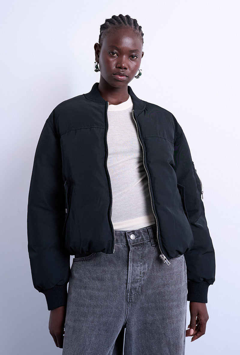 Front image of a model wearing Vera bomber in black, by brand Top shop