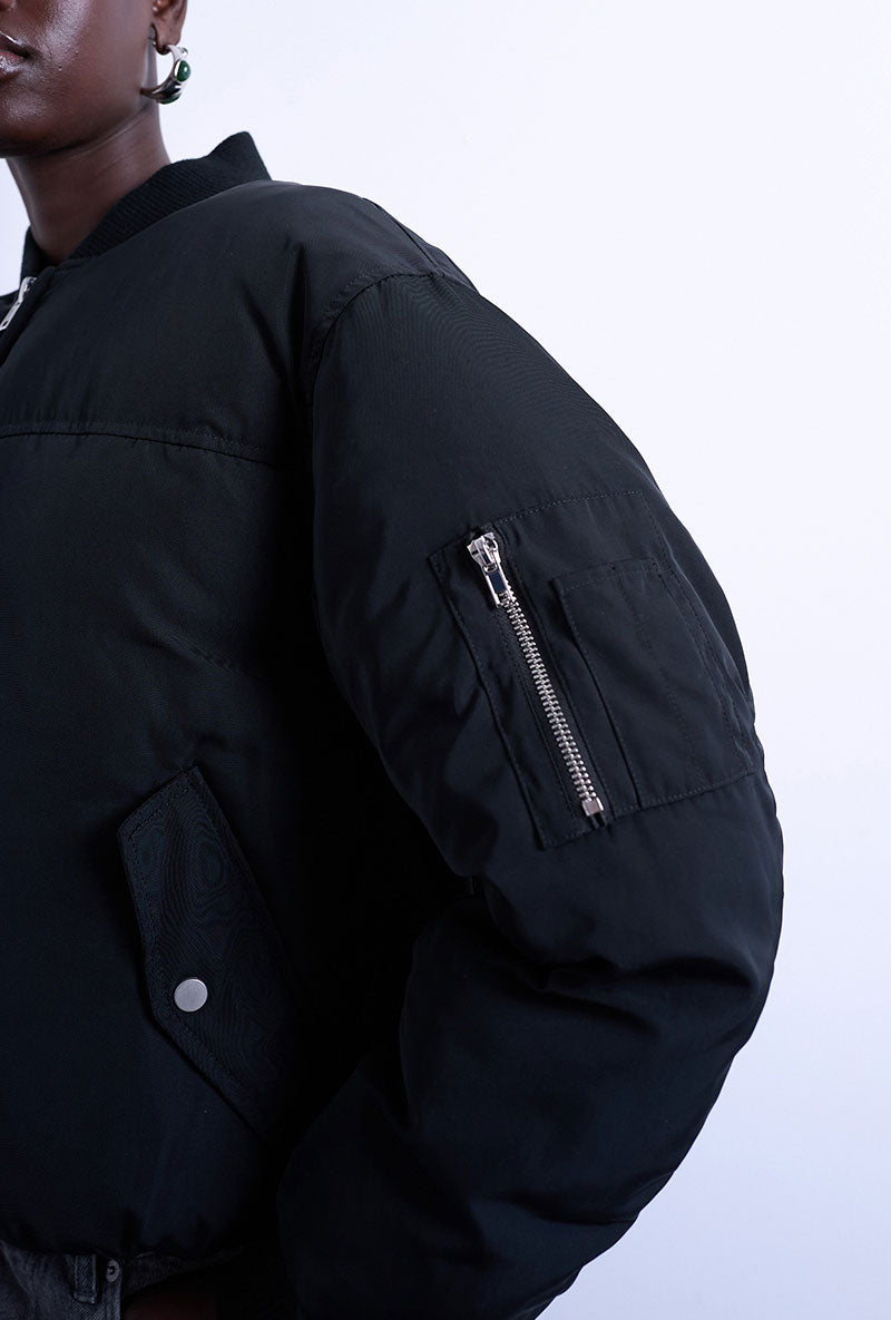 Front image of a model wearing Vera bomber in black, by brand Top shop
