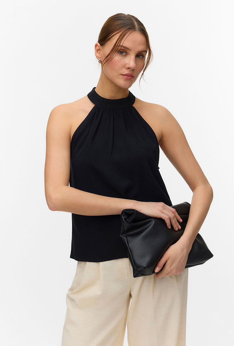 Front image of a model wearing Easy joy s/l  halterneck top in black, by brand Vero moda