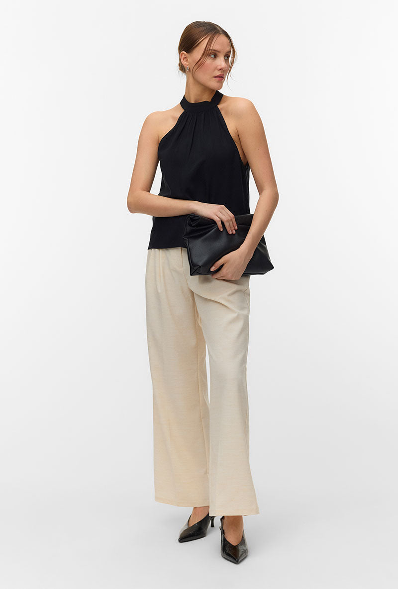 Front image of a model wearing Easy joy s/l  halterneck top in black, by brand Vero moda