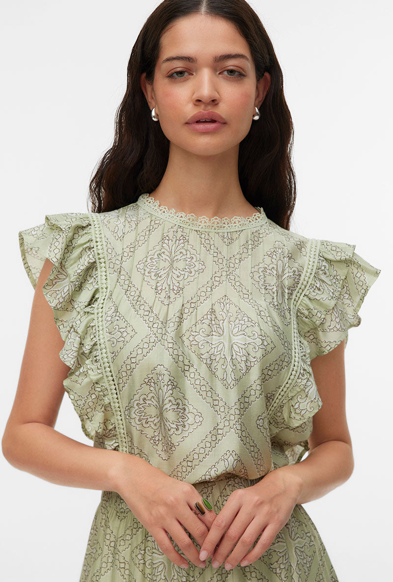 Front image of a model wearing Bliss s/l details top in green, by brand Vero moda