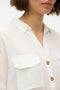 Front image of a model wearing the Bumpy ss shirt in white, by brand Vero moda