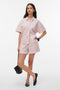 Front image of a model wearing Glow hw shorts in pink, by brand Vero moda
