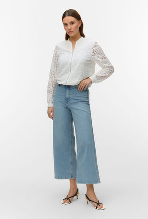 Front image of a model wearing the Honey lace bomber jacket in white, by brand Vero moda