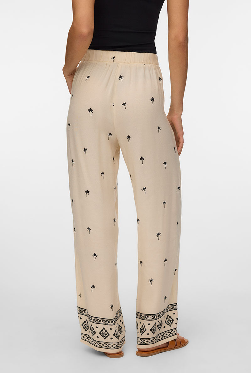 Back image of a model wearing Kai mw pants in beige, by brand Vero moda