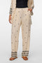 Front image of a model wearing Kai mw pants in beige, by brand Vero moda
